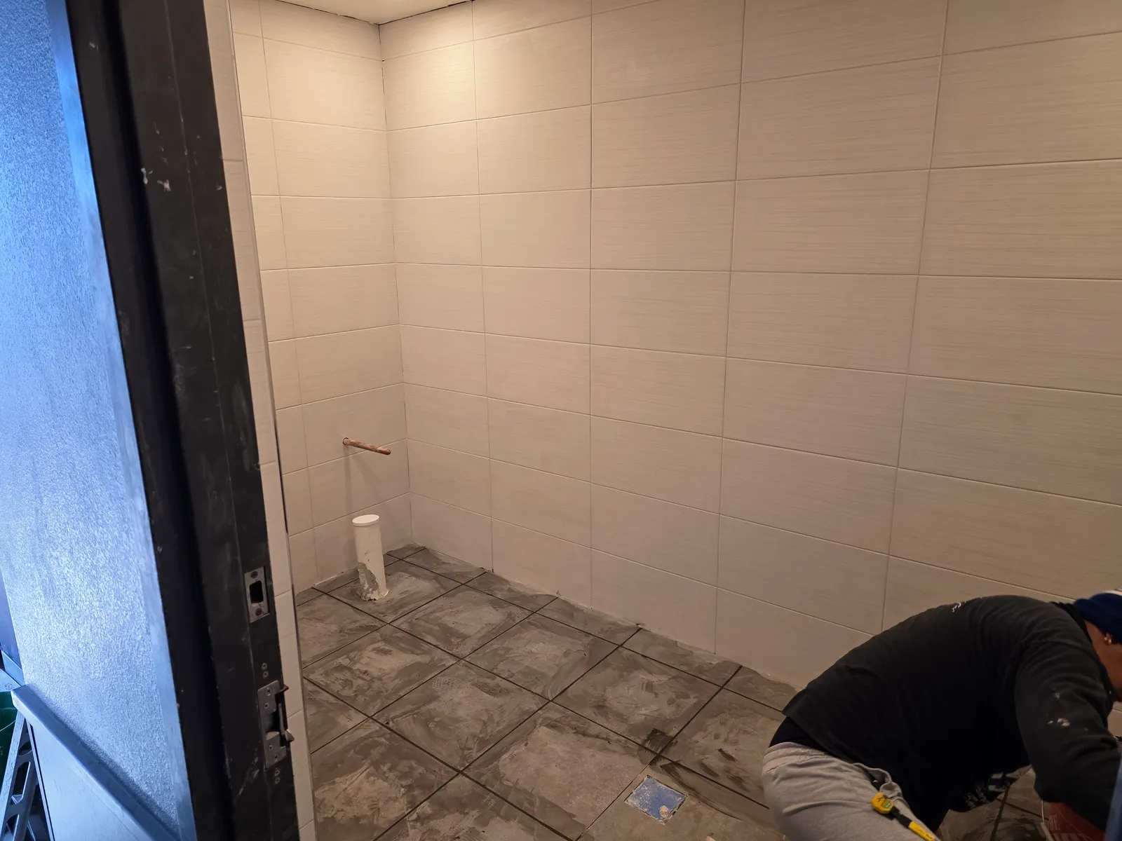 Commercial bathroom rebuild progress after repipe work