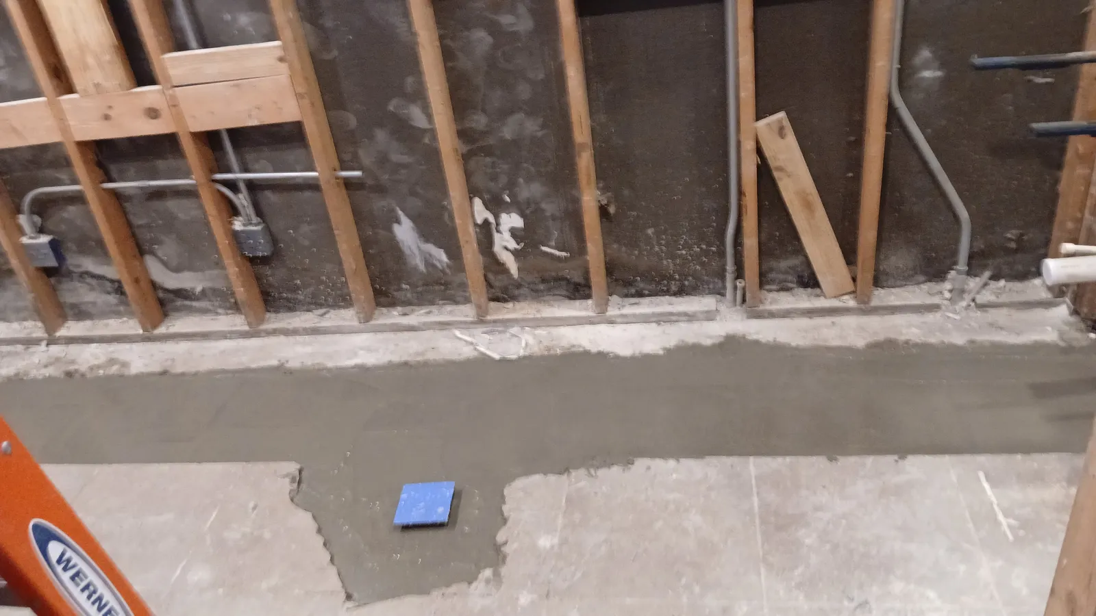 Plumbing rough-in inside commercial restroom wall